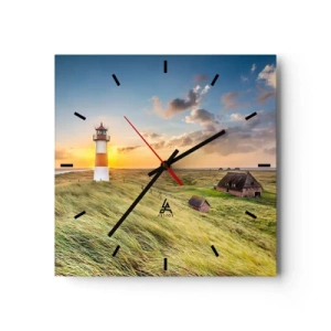 Horloge murale - Pendule murale - Un phare avec des prairies et des maisons au soleil en arrière-plan - 30x30cm - Entre les vagues - Décoration murale moderne pour le salon et la chambre ARTTOR