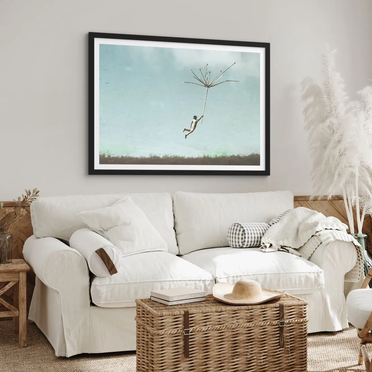 Affiche dans un cadre noir - Poster - Une silhouette soulevée par une grosse graine de pissenlit - 70x50cm - Cerfs-volants, pissenlits, vent - Décoration murale moderne pour le salon et la chambre ARTTOR