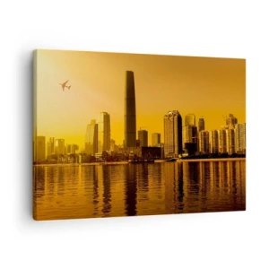 Impression sur toile - Image sur toile - Panorama de la ville au coucher du soleil avec des gratte-ciels et un avion - 70x50cm - La ville en or - Décoration murale moderne pour le salon et la chambre ARTTOR