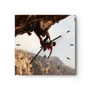 Horloge murale - Pendule murale - Un grimpeur sur une falaise abrupte dans les montagnes au soleil - 30x30cm - Le monde rétréci dans une main sur une coupe de rocher - Décoration murale moderne pour le salon et la chambre ARTTOR