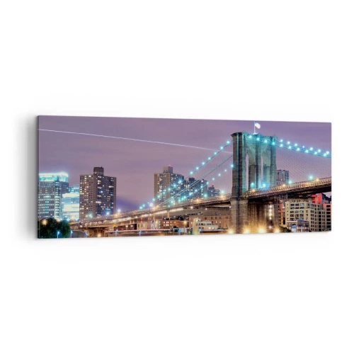 Impression sur toile - Image sur toile - Le pont de Brooklyn la nuit avec la ville illuminée en arrière-plan - 140x50cm - Depuis de nombreuses années le pont de Brooklyn - Décoration murale moderne pour le salon et la chambre ARTTOR