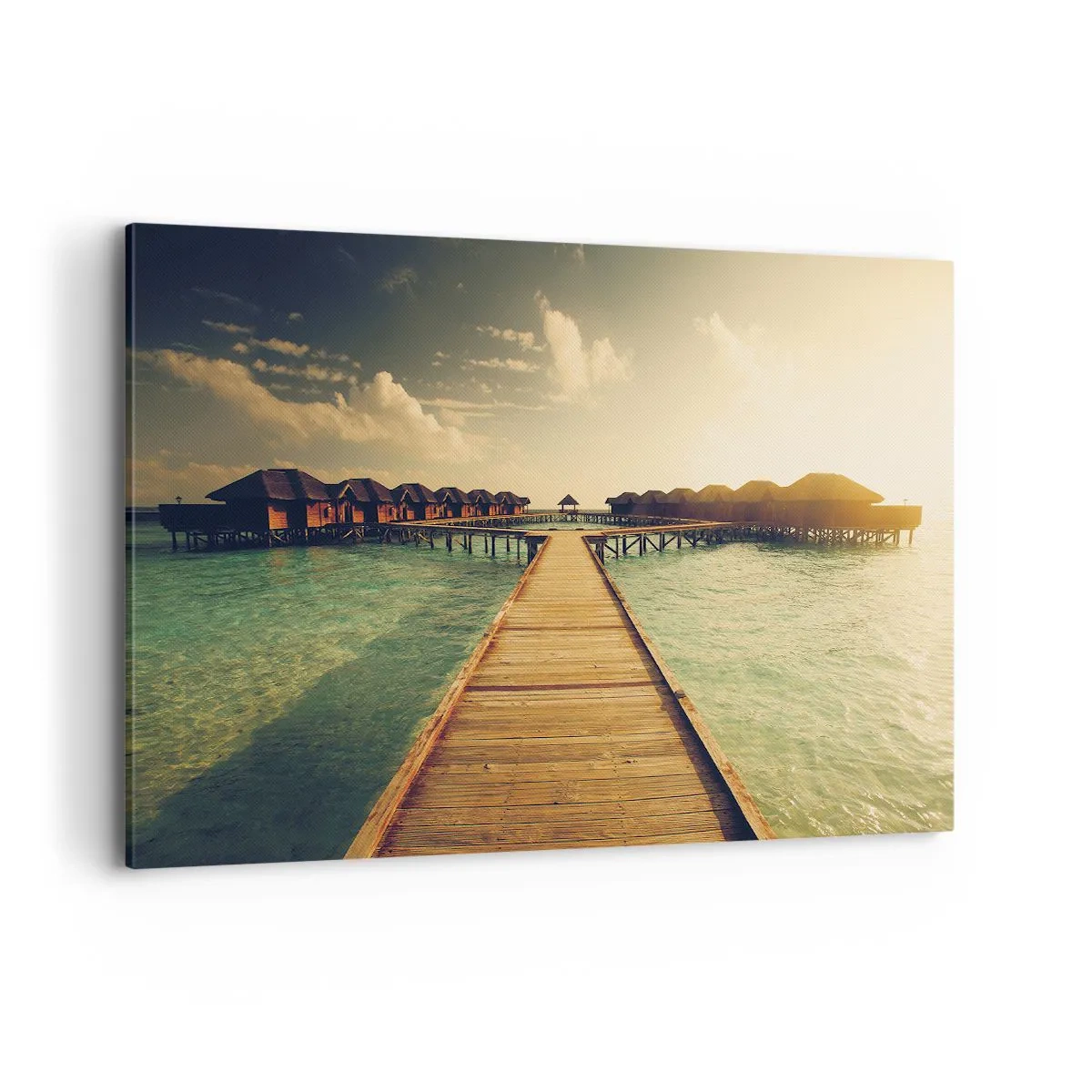 Impression sur toile - Image sur toile - Une jetée en bois menant aux maisons sur l'eau, illuminée par les rayons du soleil. - 100x70cm - Invitation chaleureuse - Décoration murale moderne pour le salon et la chambre ARTTOR