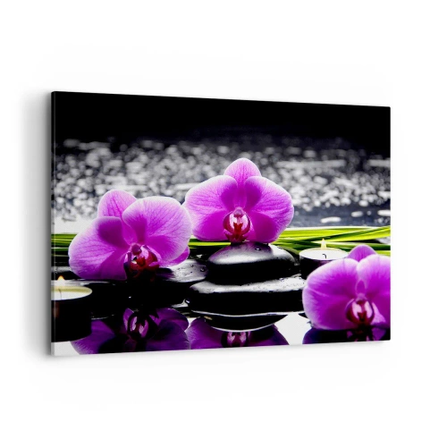 Impression sur toile - Image sur toile - Orchidées violettes sur fond de pierres et de bougies dans un cadre relaxant - 100x70cm - Se noyer dans la paix et la tranquillité - Décoration murale moderne pour le salon et la chambre ARTTOR