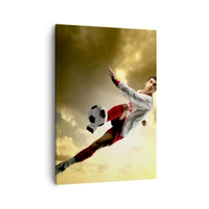 Impression sur toile - Image sur toile - Un joueur de football dans un saut dynamique frappant le ballon contre le ciel - 50x70cm - Le paradis du football - Décoration murale moderne pour le salon et la chambre ARTTOR