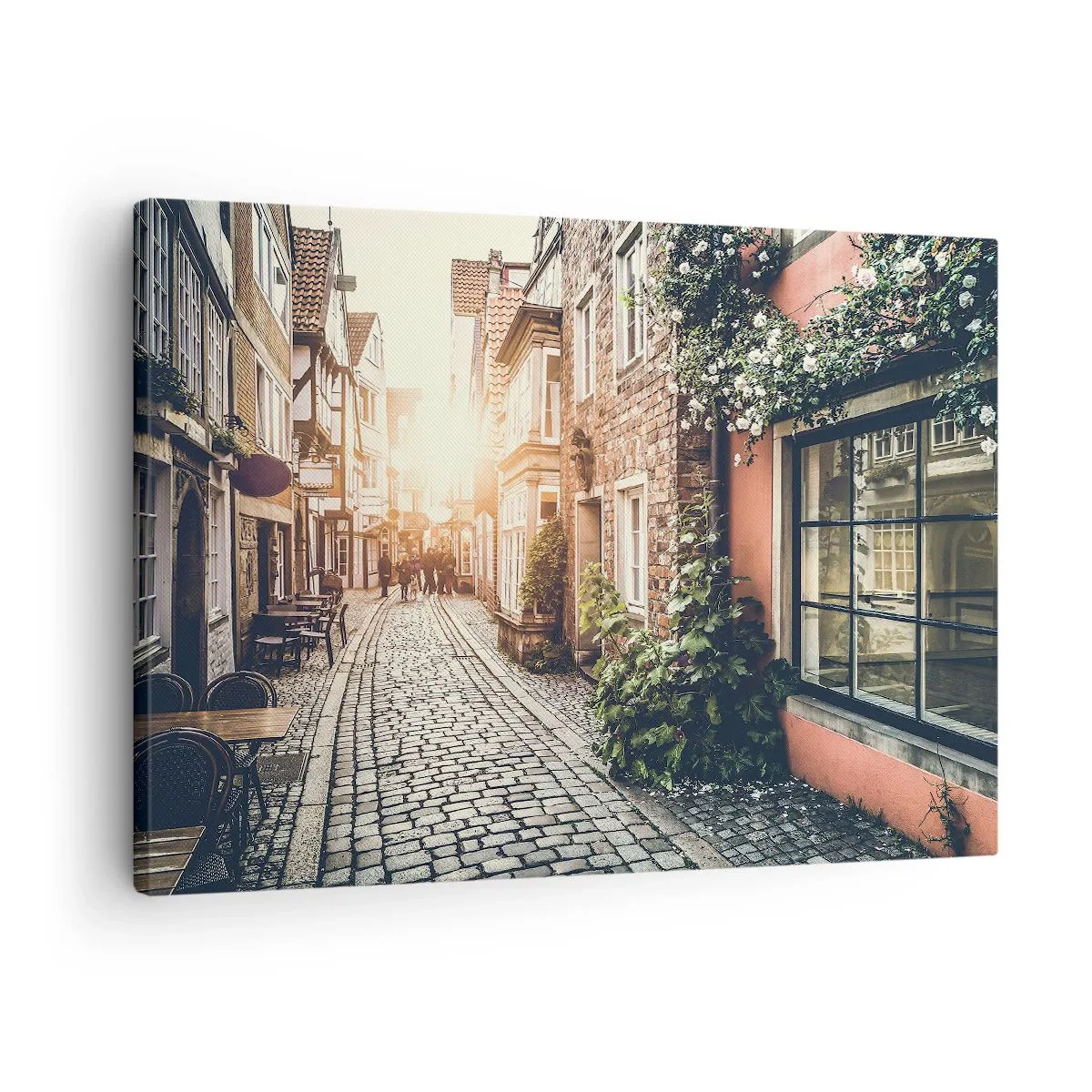 Impression sur toile - Image sur toile - Une charmante rue pavée de pierre et fleurie - 70x50cm - Allée de roses en lueur rose - Décoration murale moderne pour le salon et la chambre ARTTOR