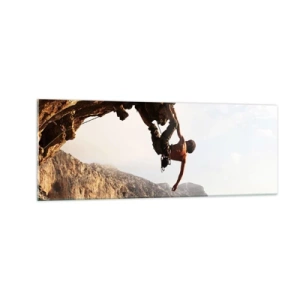 Impression sur verre - Image sur verre - Un grimpeur sur une falaise abrupte dans les montagnes au soleil - 140x50cm - Le monde rétréci dans une main sur une coupe de rocher - Décoration murale moderne pour le salon et la chambre ARTTOR