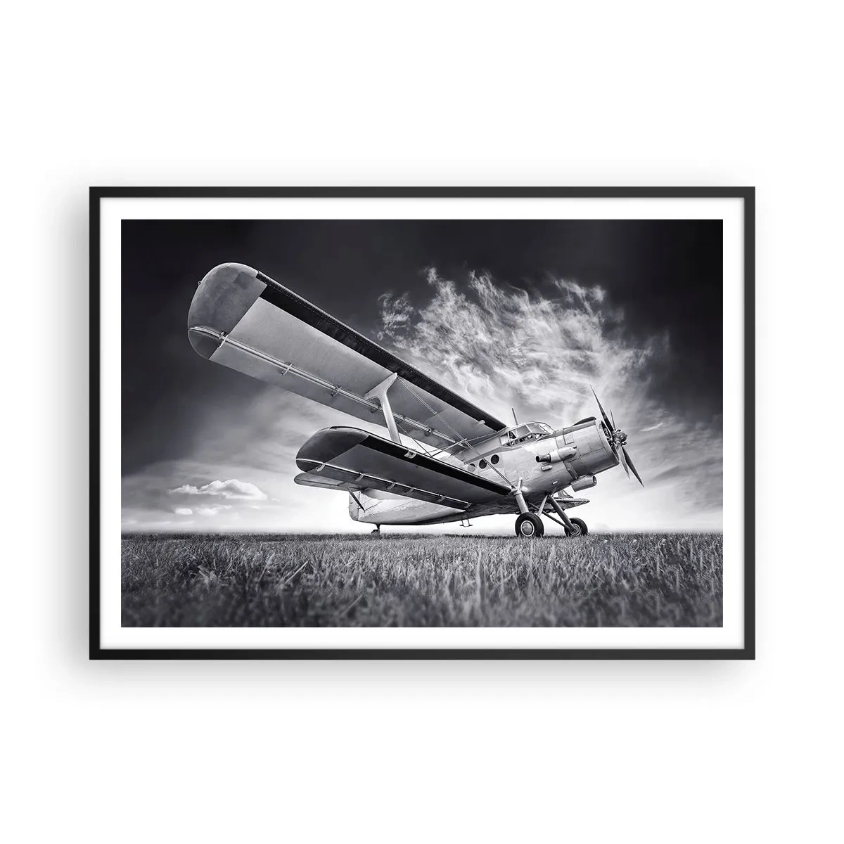 Affiche dans un cadre noir - Poster - Un avion contre un ciel dramatique en noir et blanc - 100x70cm - Le pèlerin ailé - Décoration murale moderne pour le salon et la chambre ARTTOR