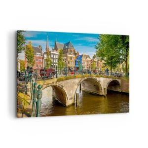 Impression sur toile - Image sur toile - Un canal pittoresque avec un pont à Amsterdam - 100x70cm - Le printemps sur le canal - Décoration murale moderne pour le salon et la chambre ARTTOR