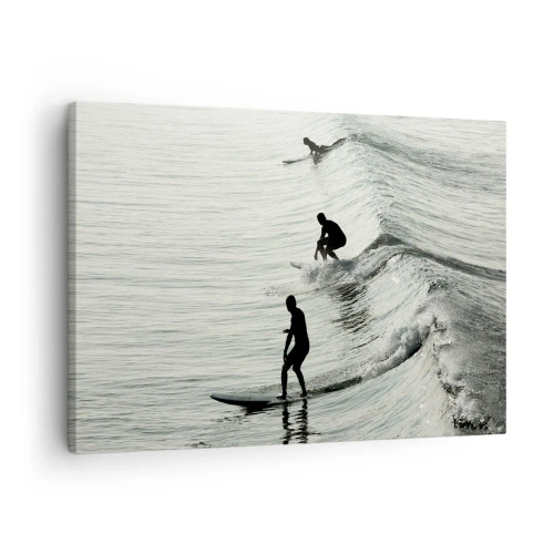 Impression sur toile - Image sur toile - Surfeurs sur les vagues dans une photo monochrome - 70x50cm - A la rencontre de la vague - Décoration murale moderne pour le salon et la chambre ARTTOR