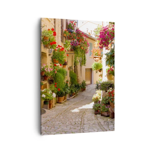 Impression sur toile - Image sur toile - Une rue avec des pots de fleurs et des murs de pierre - 50x70cm - Une inondation de fleurs  - Décoration murale moderne pour le salon et la chambre ARTTOR