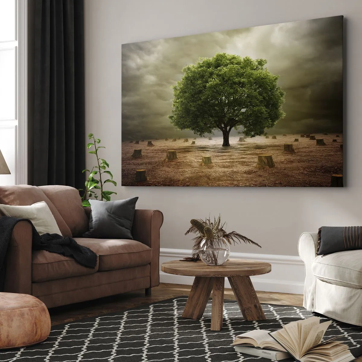 Impression sur toile - Image sur toile - Un arbre vert entouré de troncs d'arbres abattus contre un ciel nuageux - 120x80cm - Tout l'espoir - Décoration murale moderne pour le salon et la chambre ARTTOR