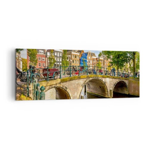 Impression sur toile - Image sur toile - Un canal pittoresque avec un pont à Amsterdam - 140x50cm - Le printemps sur le canal - Décoration murale moderne pour le salon et la chambre ARTTOR