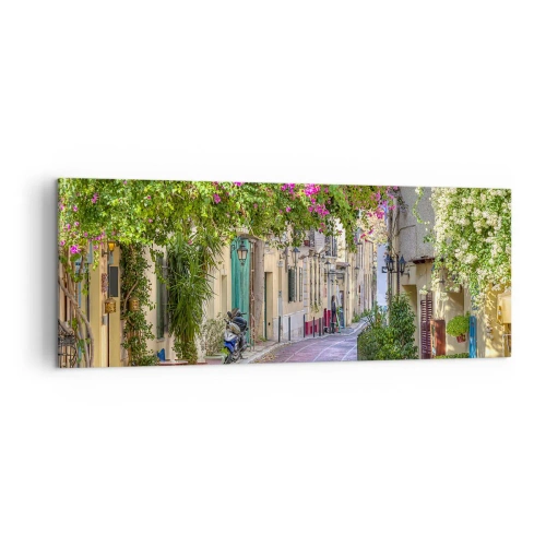 Impression sur toile - Image sur toile - Une charmante rue avec des vignes fleuries et des tables de café - 140x50cm - Allée fleurie - Décoration murale moderne pour le salon et la chambre ARTTOR