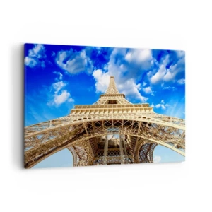 Impression sur toile - Image sur toile - La Tour Eiffel vue d'en bas contre un ciel bleu - 100x70cm - Atteindre le ciel et les nuages - Décoration murale moderne pour le salon et la chambre ARTTOR
