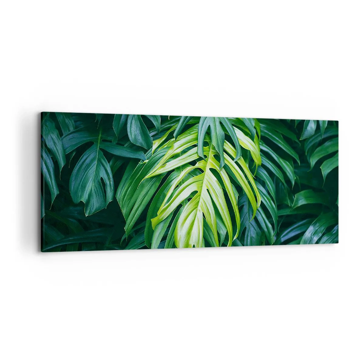 Impression sur toile - Image sur toile - Feuilles vertes dans un arrangement tropical dense - 120x50cm - Immergez-vous dans la fraîcheur - Décoration murale moderne pour le salon et la chambre ARTTOR