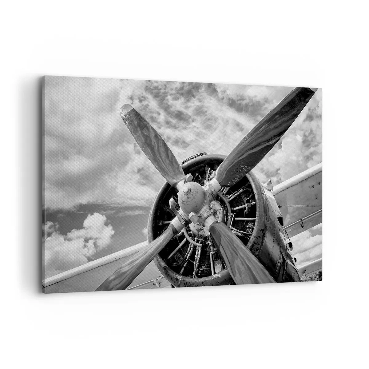 Impression sur toile - Image sur toile - Une photo en noir et blanc d'une hélice d'avion contre un ciel dynamique. - 120x80cm - Dompteur de ciel - Décoration murale moderne pour le salon et la chambre ARTTOR
