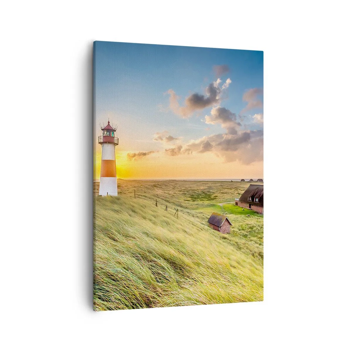 Impression sur toile - Image sur toile - Un phare avec des prairies et des maisons au soleil en arrière-plan - 50x70cm - Entre les vagues - Décoration murale moderne pour le salon et la chambre ARTTOR