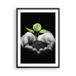 Affiche dans un cadre noir - Poster - Une plante dans les mains symbolisant la vie et la nature - 50x70cm - J'aime la nature, je la protège - Décoration murale moderne pour le salon et la chambre ARTTOR