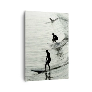 Impression sur toile - Image sur toile - Surfeurs sur les vagues dans une photo monochrome - 70x100cm - A la rencontre de la vague - Décoration murale moderne pour le salon et la chambre ARTTOR