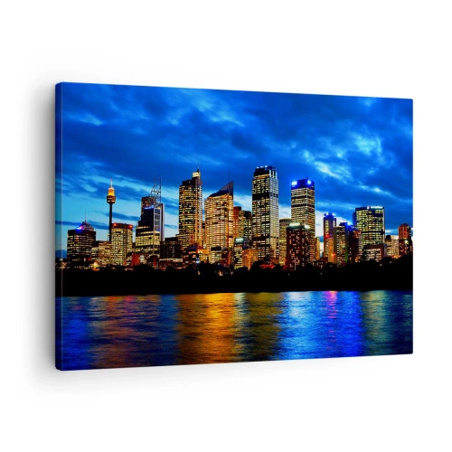 Impression sur toile - Image sur toile - Panorama de la ville nocturne avec des gratte-ciel illuminés au-dessus de l'eau - 70x50cm - Une nuit de lumières et de couleurs - Décoration murale moderne pour le salon et la chambre ARTTOR