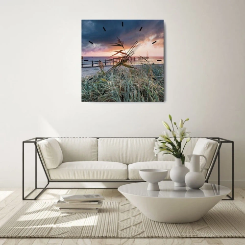 Horloge murale - Pendule murale - Plage au coucher du soleil avec des herbes au premier plan - 30x30cm - Ça ne passe pas avec le vent - Décoration murale moderne pour le salon et la chambre ARTTOR