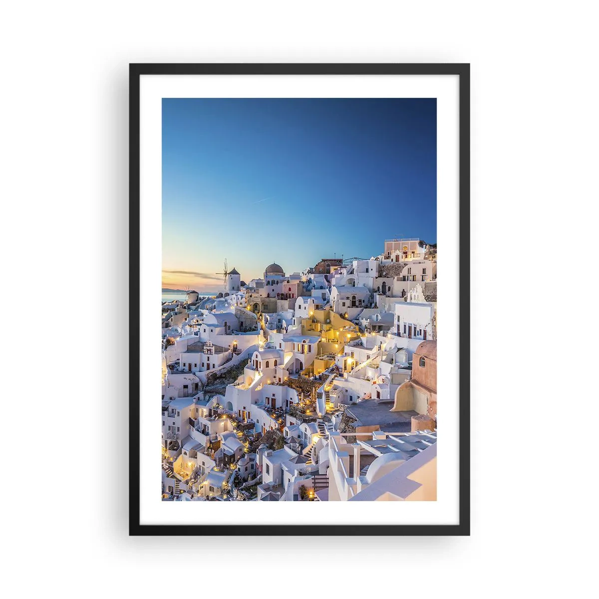 Affiche dans un cadre noir - Poster - Vue des maisons illuminées de Santorin au coucher du soleil - 50x70cm - L'essence de la grecque - Décoration murale moderne pour le salon et la chambre ARTTOR