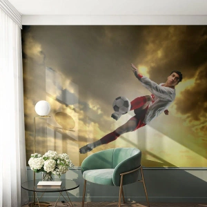 Papier Peint Photo Premium Sand - Une prise de vue dynamique d'un joueur de football frappant le ballon - 100x70cm - Le paradis du football - Décoration murale moderne pour le salon et la chambre ARTTOR