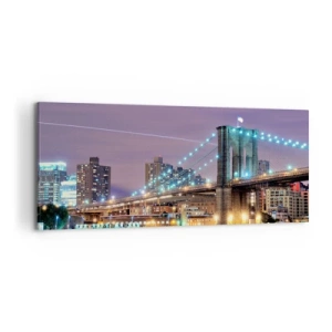 Impression sur toile - Image sur toile - Le pont de Brooklyn la nuit avec la ville illuminée en arrière-plan - 120x50cm - Depuis de nombreuses années le pont de Brooklyn - Décoration murale moderne pour le salon et la chambre ARTTOR