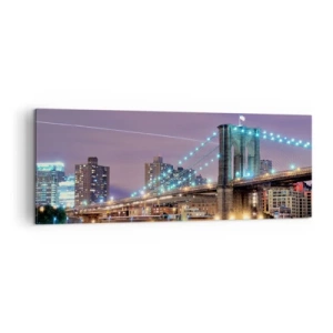 Impression sur toile - Image sur toile - Le pont de Brooklyn la nuit avec la ville illuminée en arrière-plan - 140x50cm - Depuis de nombreuses années le pont de Brooklyn - Décoration murale moderne pour le salon et la chambre ARTTOR
