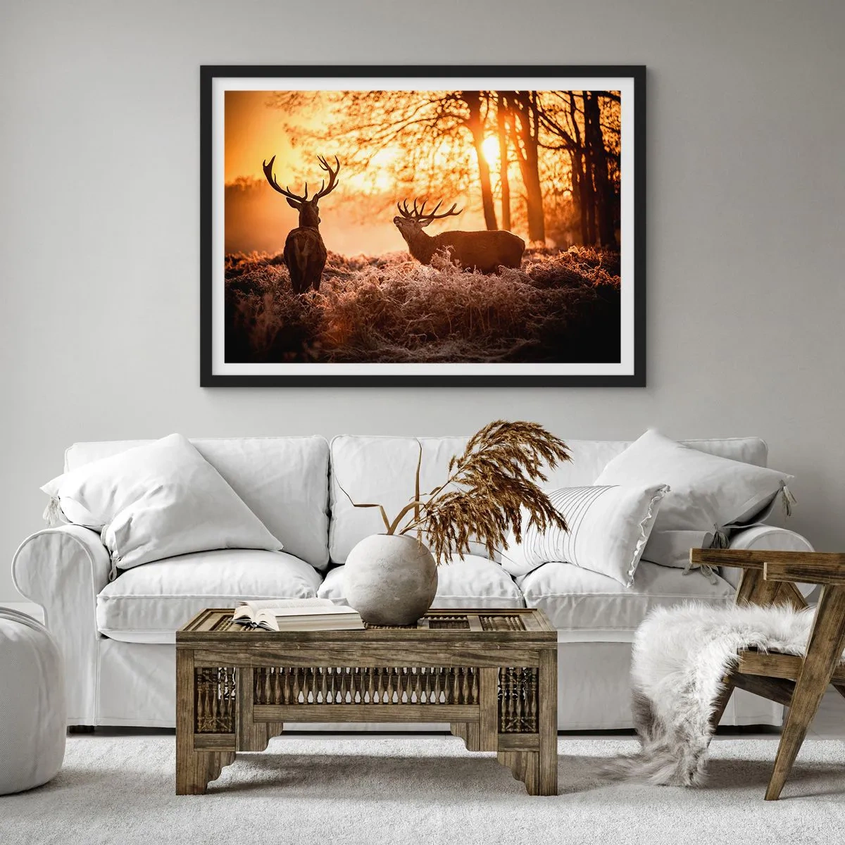 Affiche dans un cadre noir - Poster - Deux cerfs au coucher du soleil dans un paysage hivernal - 100x70cm - Le rêve d'un chasseur - Décoration murale moderne pour le salon et la chambre ARTTOR