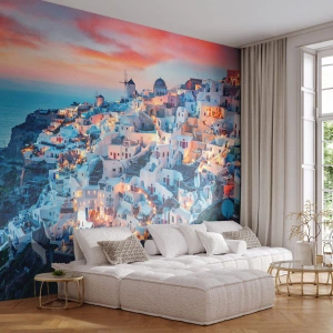 Papier Peint Photo Premium Canvas - Santorin au coucher du soleil avec des bâtiments blancs sur la colline - 100x70cm - Vos grandes vacances en Grèce - Décoration murale moderne pour le salon et la chambre ARTTOR