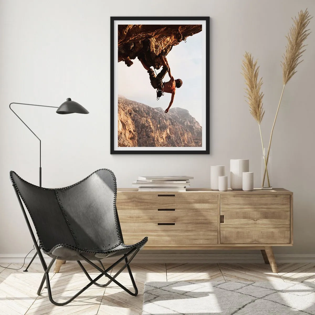 Affiche dans un cadre noir - Poster - Le monde rétréci dans une main sur une coupe de rocher - 30x40 cm