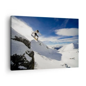 Impression sur toile - Image sur toile - Un snowboardeur saute d'une falaise avec des montagnes enneigées en arrière-plan. - 70x50cm - Liberté sans limite - Décoration murale moderne pour le salon et la chambre ARTTOR