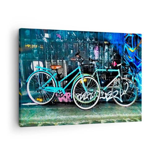 Impression sur toile - Image sur toile - Deux vélos turquoise sur fond de graffitis urbains. - 70x50cm - L'appel de la ville - Décoration murale moderne pour le salon et la chambre ARTTOR